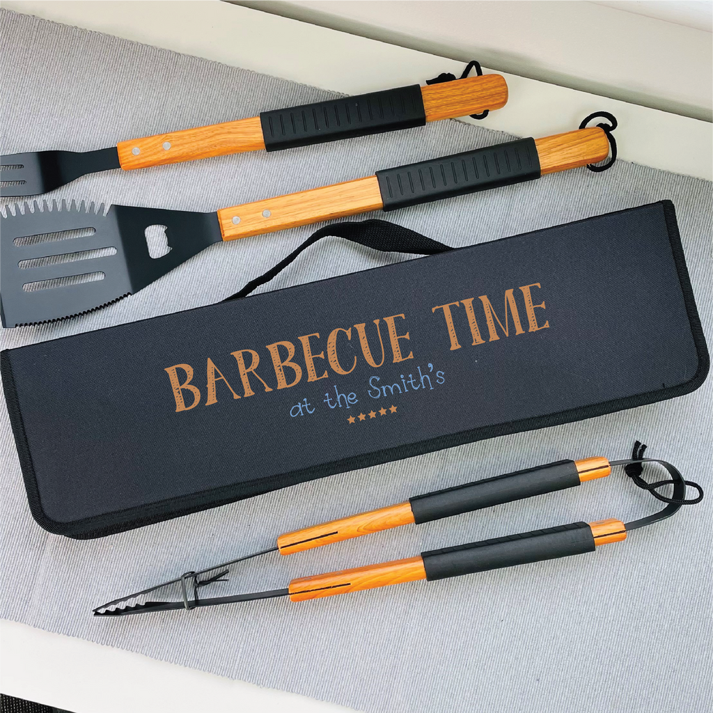 Barbecue tool set with personalized case on a white surface