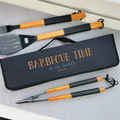 Barbecue tool set with personalized case on a white surface