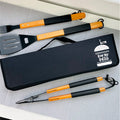 Set of barbecue tools with black carrying case on a light gray surface