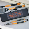 Barbecue tool set with 'No. 1 Dad' case on a gray surface