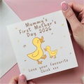 Card for Mummy's First Mother's Day 2026 with a yellow duck and chick illustration on a pink background.