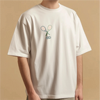 Person wearing a white t-shirt with a logo on a beige background