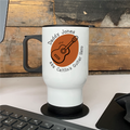 White mug with guitar design and text on a wooden surface