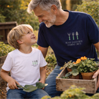 Man and child in a garden setting with potted plants, wearing matching t-shirts.
