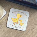 Coaster with ducks and 'Happy Mother's Day' text on a wooden surface