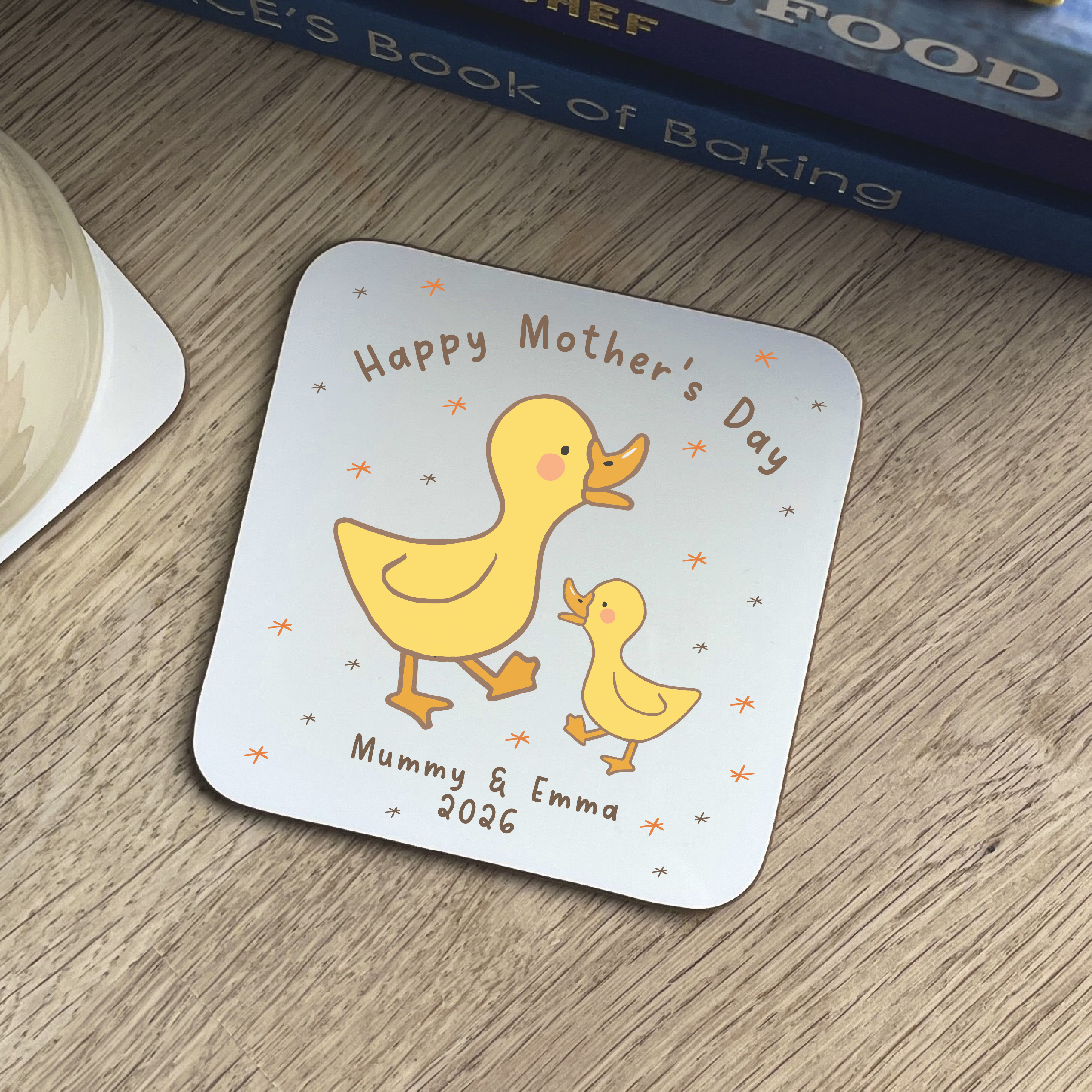 Coaster with ducks and 'Happy Mother's Day' text on a wooden surface