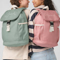 Two children wearing personalized backpacks with names 'Jacob' and 'Hannah'.