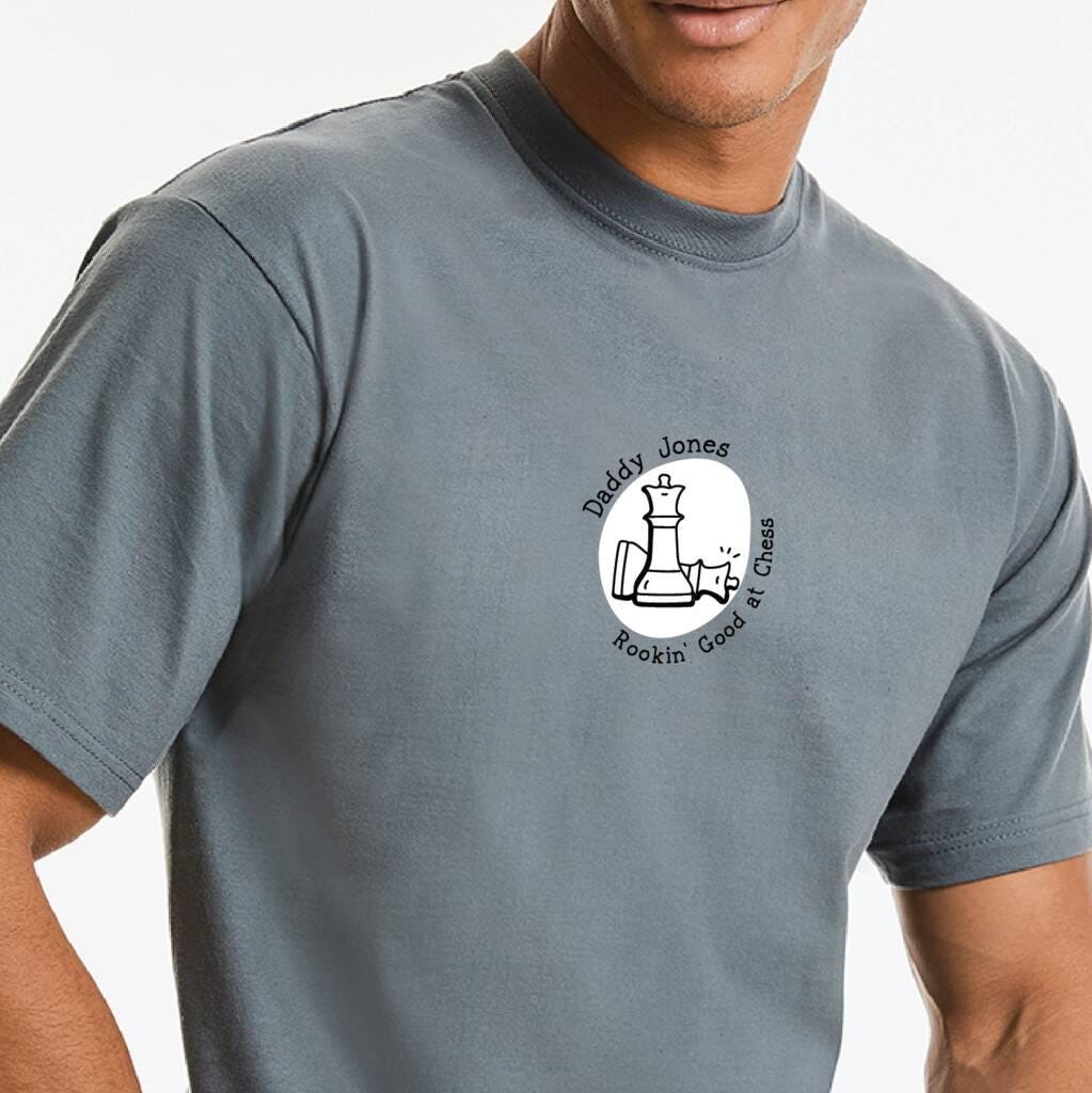 Man wearing a t-shirt with a chess player logo.