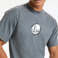 Man wearing a t-shirt with a chess player logo.