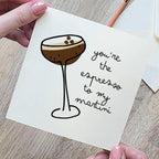 Card with a drawing of an espresso martini and text 'you're the espresso to my martini' held by a hand.