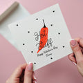 Card with red chili pepper and 'Hot Stuff' text on a pink background