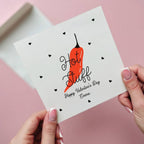 Card with red chili pepper and 'Hot Stuff' text on a pink background