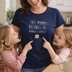 Woman wearing a navy blue t-shirt with 'This Mummy Belongs To: Hannah & Harriet' text and two children pointing at it.