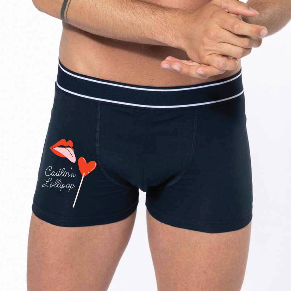Navy blue boxer briefs with a logo on a white background